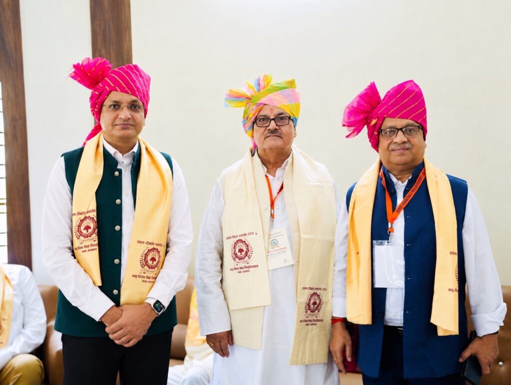 Rajeev Singh with Garhwa University Vice Chancellor Dr. M. K. Singh and university team during the First Convocation, discussing agriculture and farmer-focused initiatives.